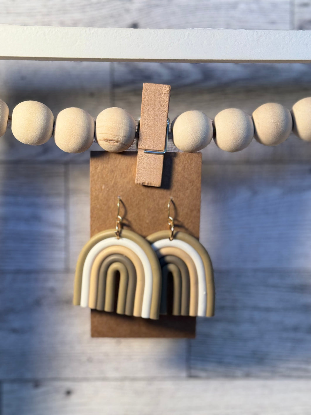 Light brown arch earrings