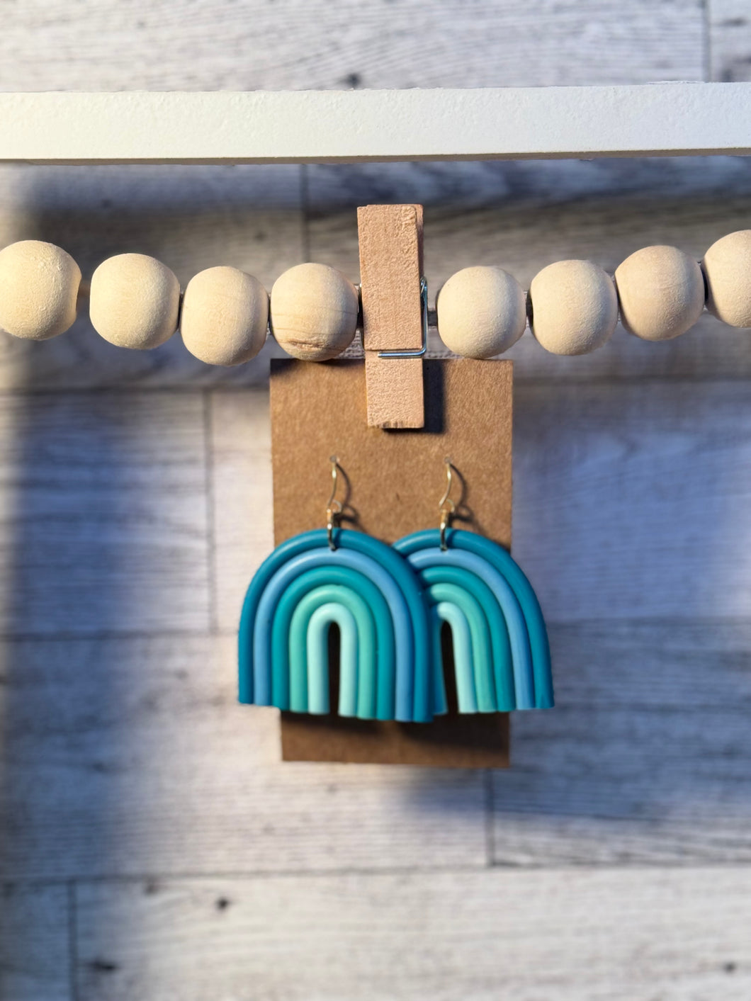 Blue and green arch earrings