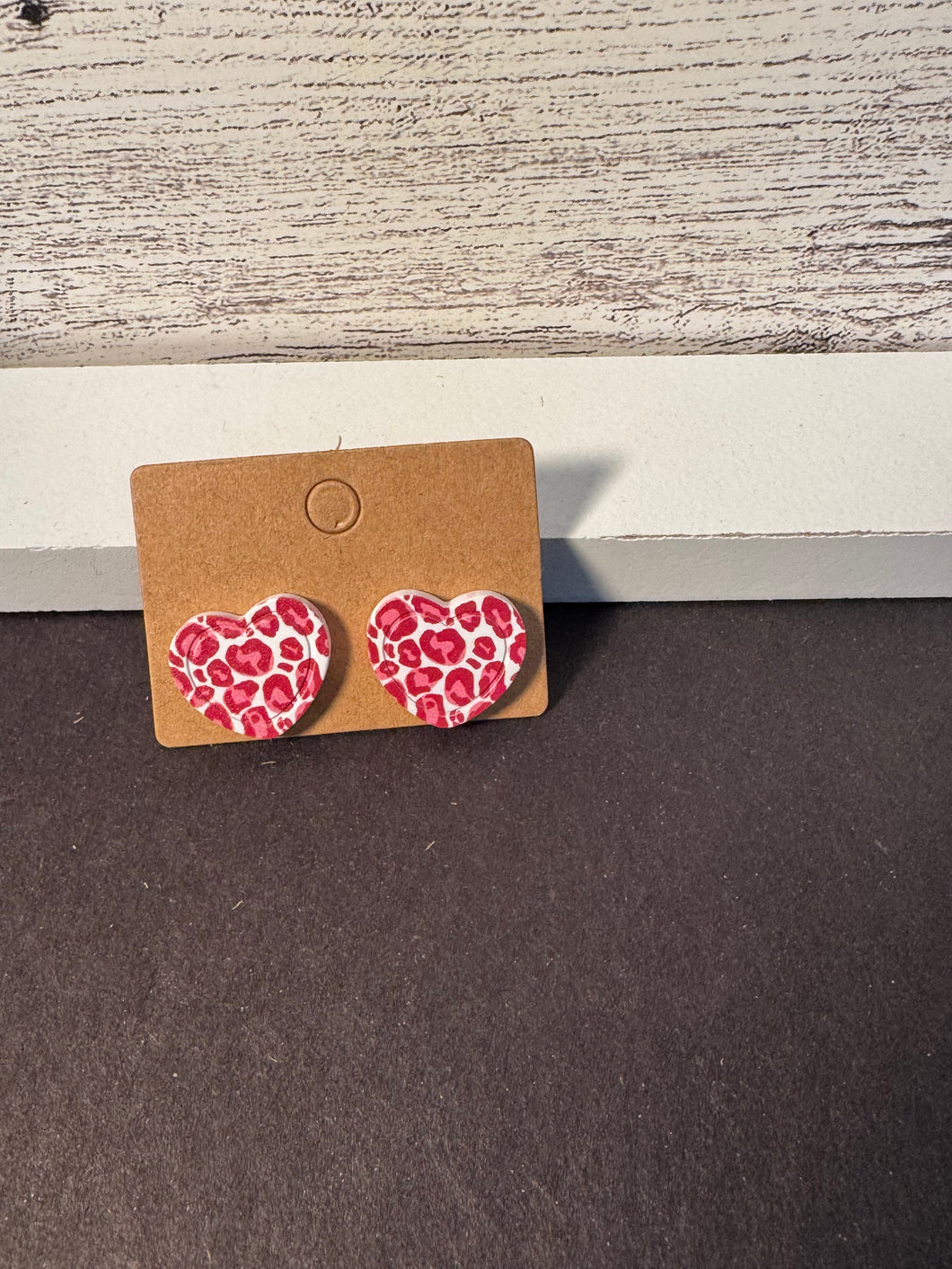 Pink leopard heart studs