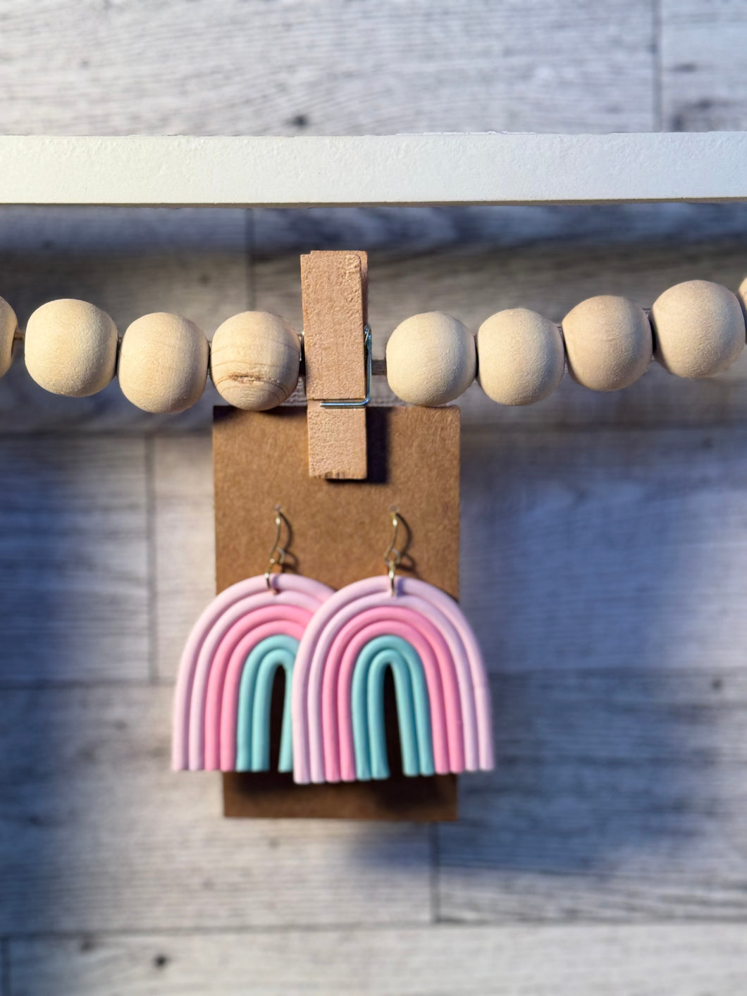 Pink and green arch earrings